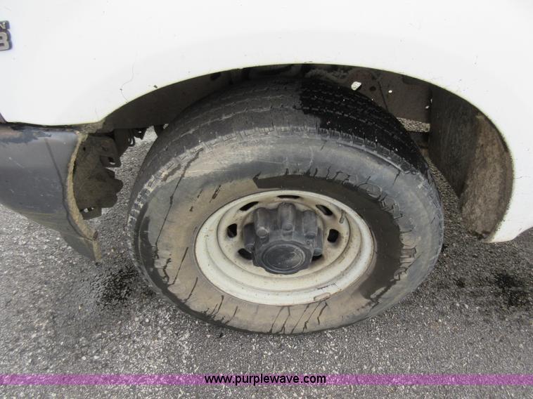 image for item AW9105 2002 Ford F350 Super Duty XL Crew Cab flatbed truck