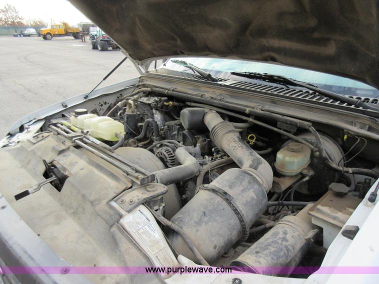 image for item AW9105 2002 Ford F350 Super Duty XL Crew Cab flatbed truck