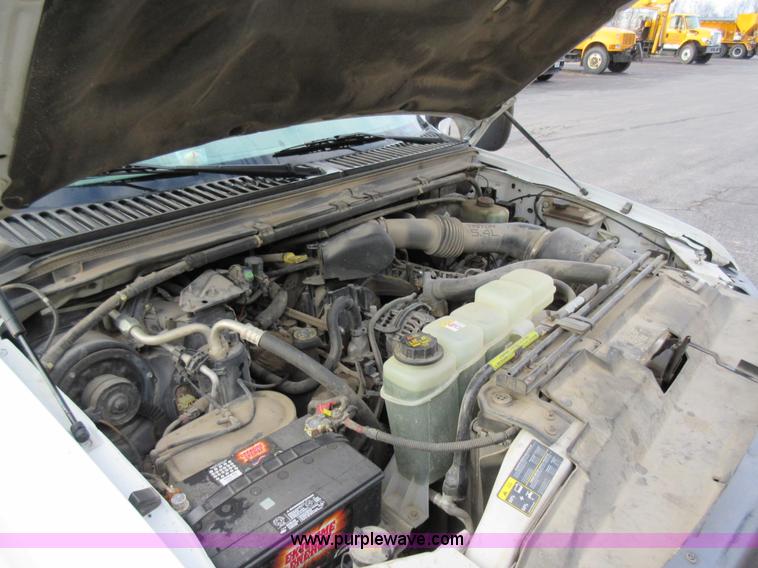 image for item AW9105 2002 Ford F350 Super Duty XL Crew Cab flatbed truck