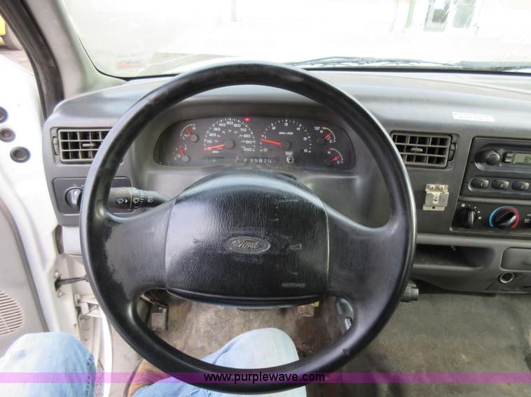 image for item AW9105 2002 Ford F350 Super Duty XL Crew Cab flatbed truck