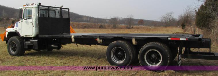 image for item I3120 1987 Mack DM686S flatbed truck