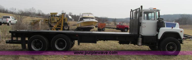 image for item I3120 1987 Mack DM686S flatbed truck