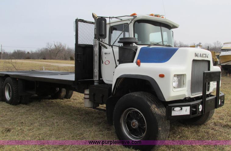 image for item I3120 1987 Mack DM686S flatbed truck