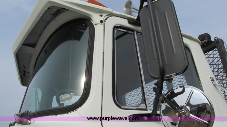 image for item I3120 1987 Mack DM686S flatbed truck