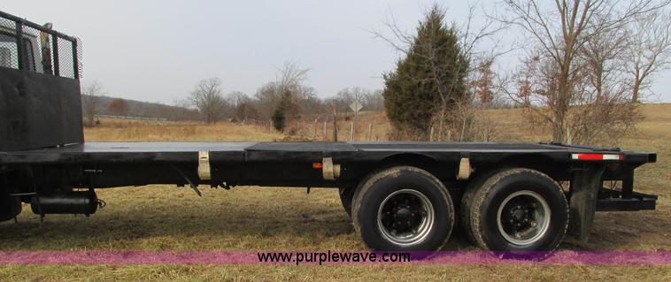 image for item I3120 1987 Mack DM686S flatbed truck