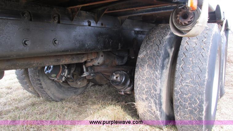 image for item I3120 1987 Mack DM686S flatbed truck