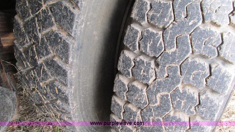 image for item I3120 1987 Mack DM686S flatbed truck