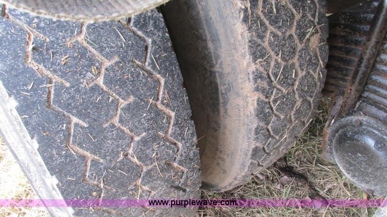 image for item I3120 1987 Mack DM686S flatbed truck