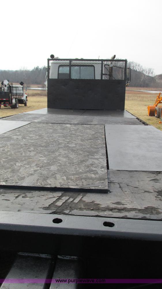 image for item I3120 1987 Mack DM686S flatbed truck