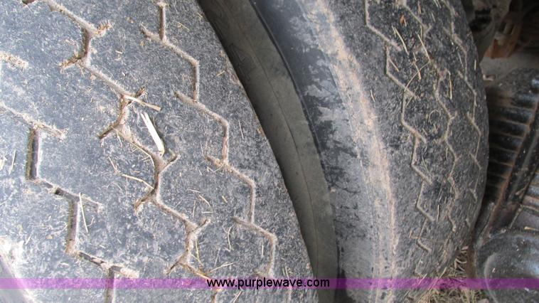 image for item I3120 1987 Mack DM686S flatbed truck