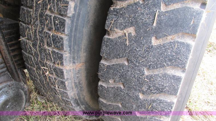 image for item I3120 1987 Mack DM686S flatbed truck