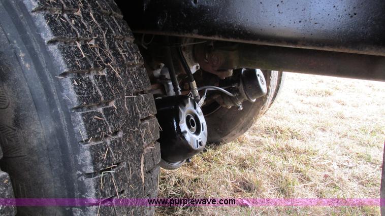 image for item I3120 1987 Mack DM686S flatbed truck