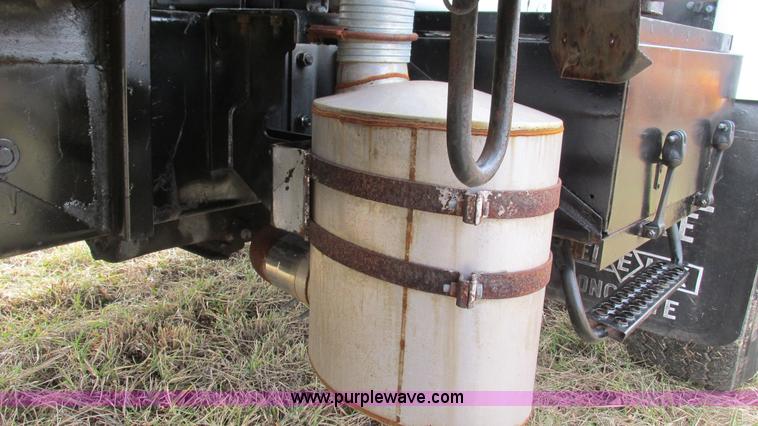 image for item I3120 1987 Mack DM686S flatbed truck