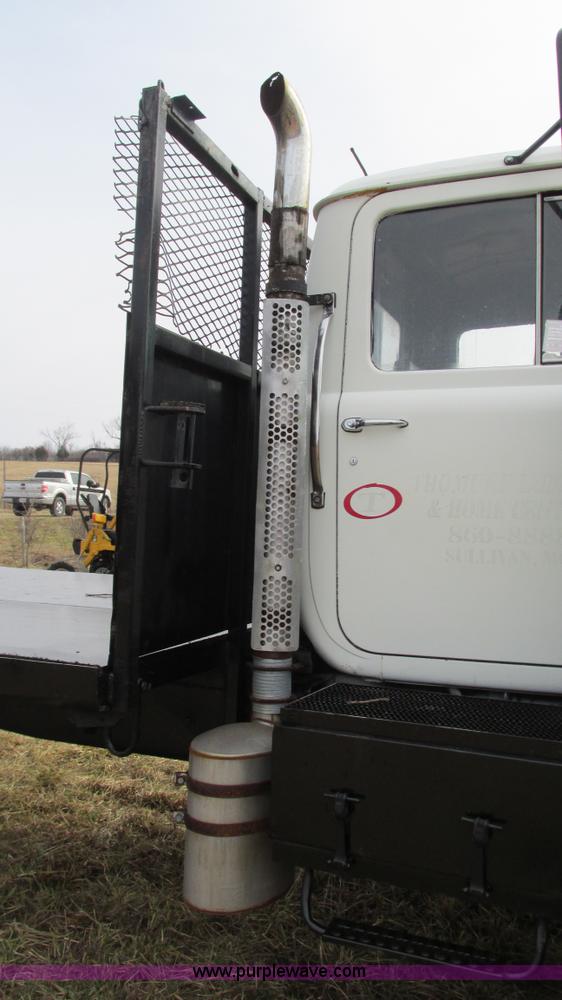 image for item I3120 1987 Mack DM686S flatbed truck