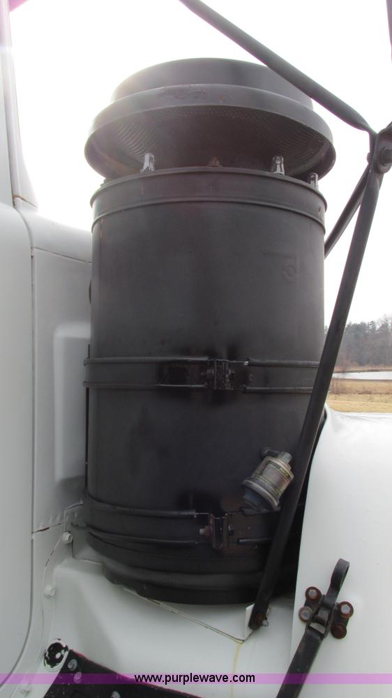 image for item I3120 1987 Mack DM686S flatbed truck