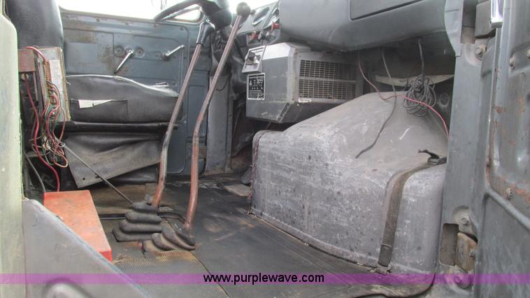 image for item I3120 1987 Mack DM686S flatbed truck