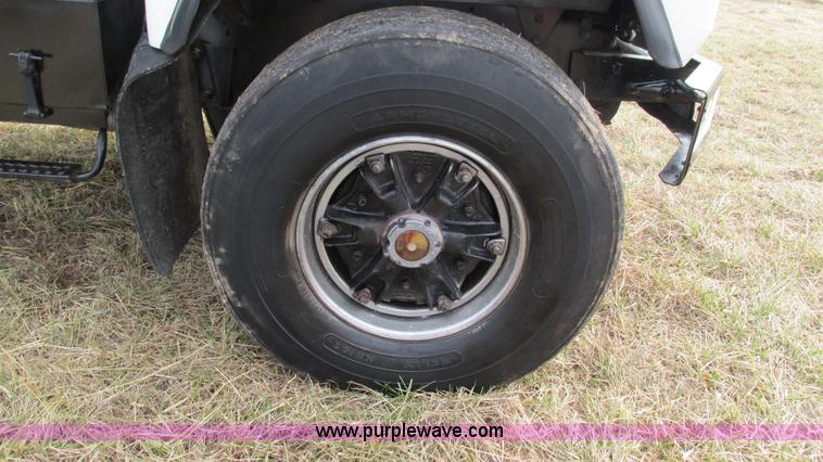 image for item I3120 1987 Mack DM686S flatbed truck