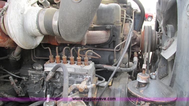 image for item I3120 1987 Mack DM686S flatbed truck