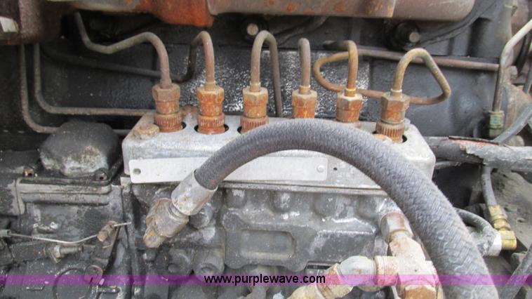 image for item I3120 1987 Mack DM686S flatbed truck