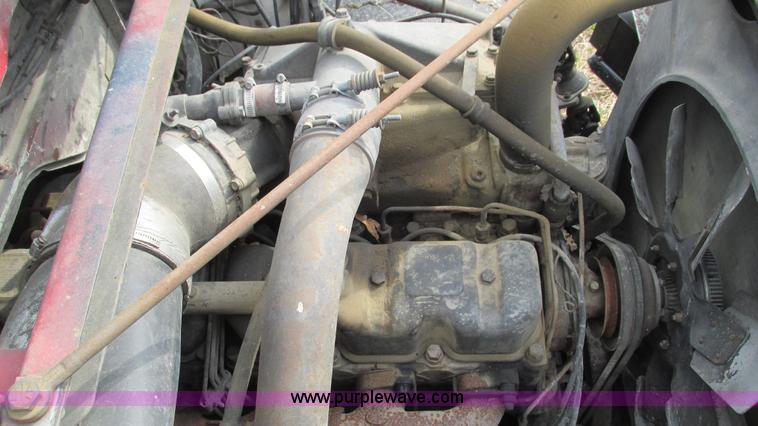 image for item I3120 1987 Mack DM686S flatbed truck