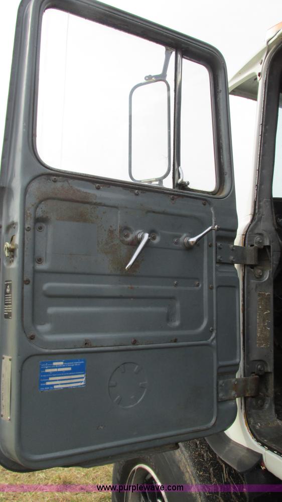 image for item I3120 1987 Mack DM686S flatbed truck