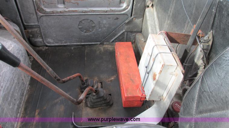 image for item I3120 1987 Mack DM686S flatbed truck