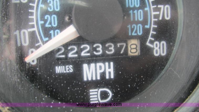 image for item I3120 1987 Mack DM686S flatbed truck