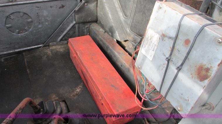 image for item I3120 1987 Mack DM686S flatbed truck