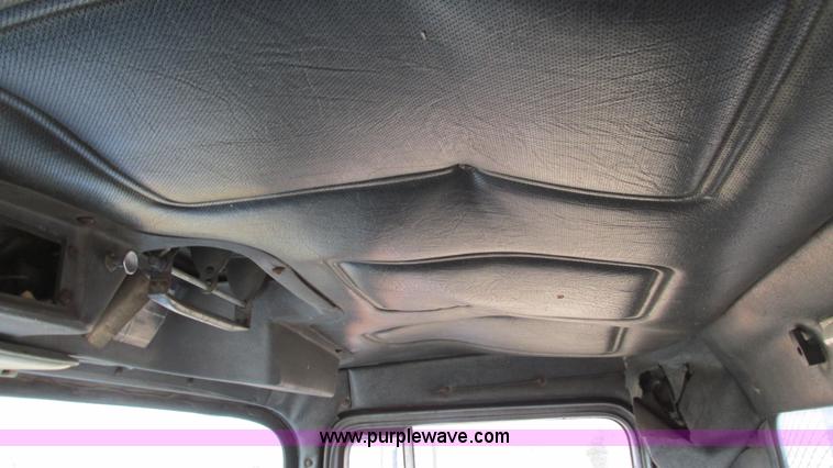 image for item I3120 1987 Mack DM686S flatbed truck