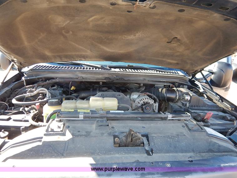 image for item I5140 2000 Ford F450 Super Duty flatbed dump truck