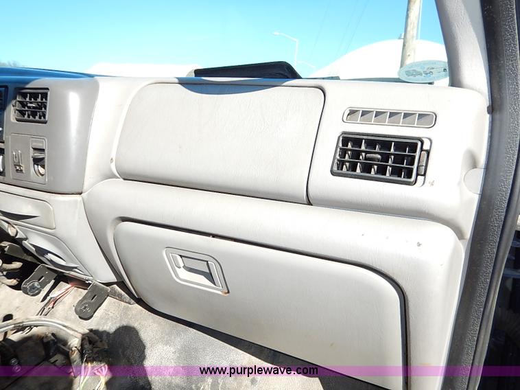 image for item I5140 2000 Ford F450 Super Duty flatbed dump truck