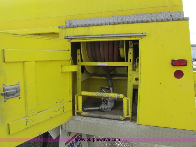 image for item I8812 1999 Freightliner FL70 fuel truck