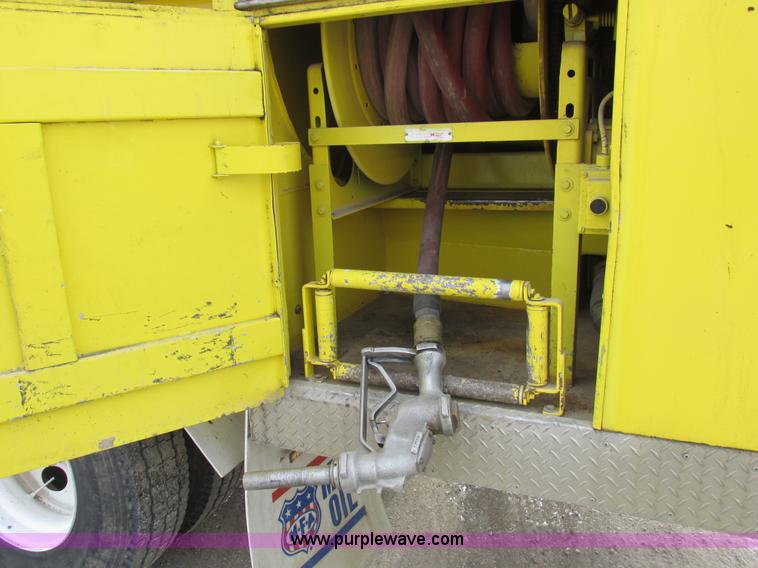 image for item I8812 1999 Freightliner FL70 fuel truck