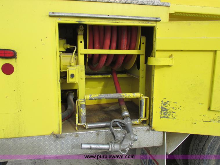 image for item I8812 1999 Freightliner FL70 fuel truck