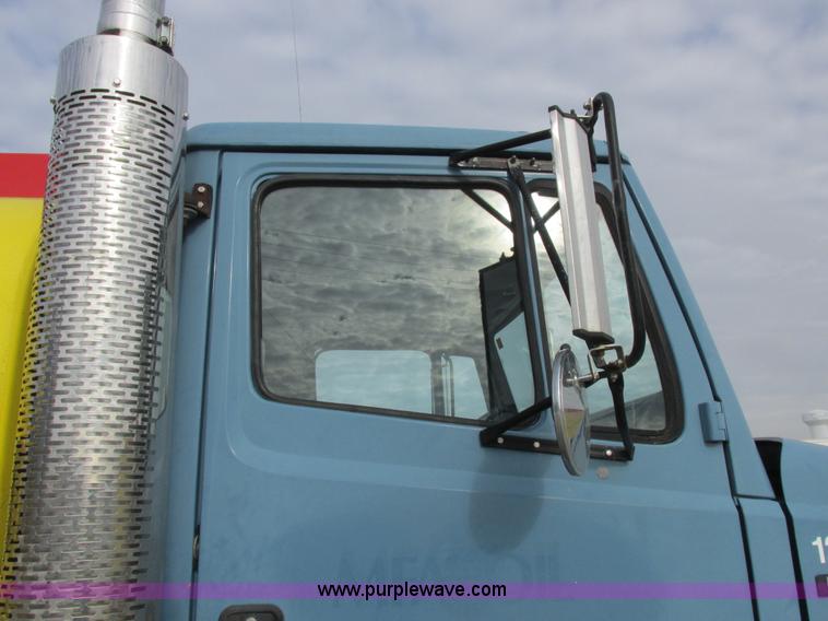 image for item I8812 1999 Freightliner FL70 fuel truck