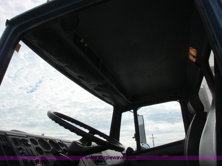 image for item I8812 1999 Freightliner FL70 fuel truck