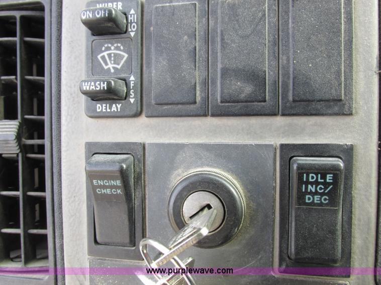 image for item I8812 1999 Freightliner FL70 fuel truck