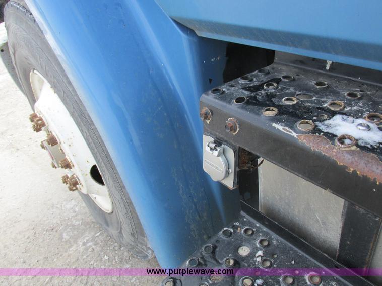 image for item I8814 2000 Freightliner FL70 fuel truck