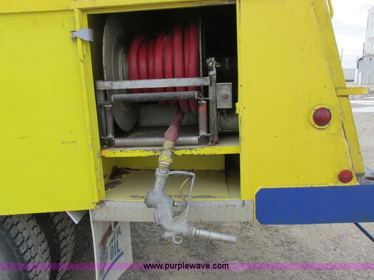 image for item I8814 2000 Freightliner FL70 fuel truck