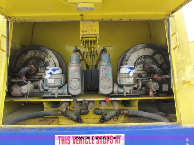 image for item I8814 2000 Freightliner FL70 fuel truck