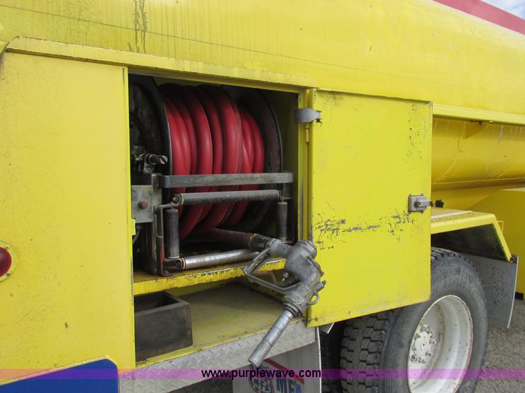 image for item I8814 2000 Freightliner FL70 fuel truck