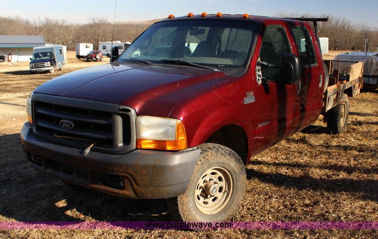 image for item L6552 2000 Ford F350 Super Duty XLT Crew Cab flatbed pickup truck