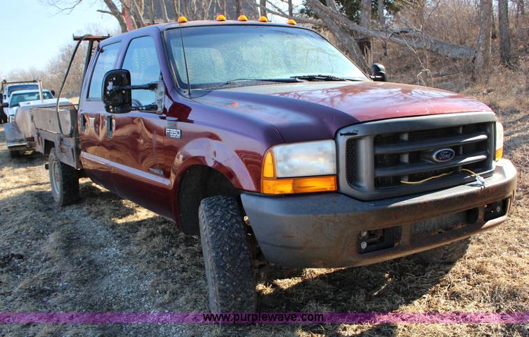 image for item L6552 2000 Ford F350 Super Duty XLT Crew Cab flatbed pickup truck