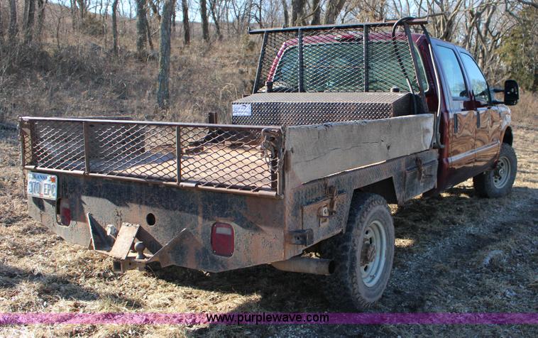 image for item L6552 2000 Ford F350 Super Duty XLT Crew Cab flatbed pickup truck