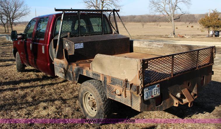 image for item L6552 2000 Ford F350 Super Duty XLT Crew Cab flatbed pickup truck