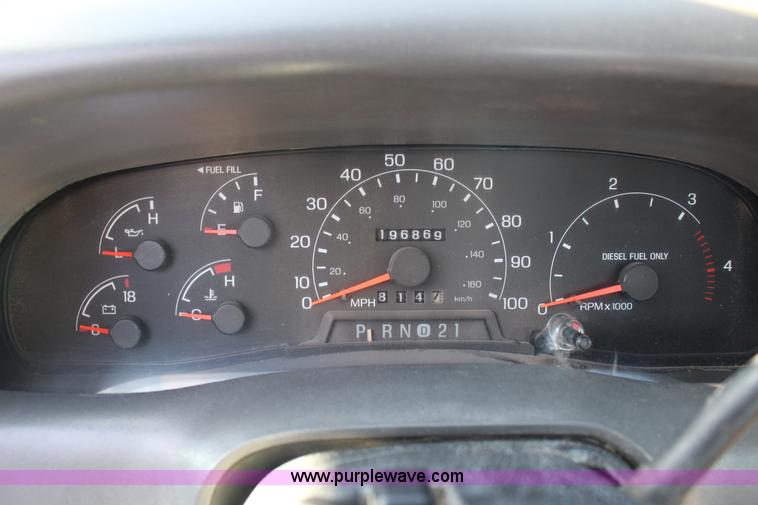 image for item L6552 2000 Ford F350 Super Duty XLT Crew Cab flatbed pickup truck