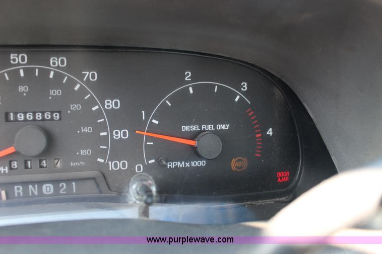 image for item L6552 2000 Ford F350 Super Duty XLT Crew Cab flatbed pickup truck