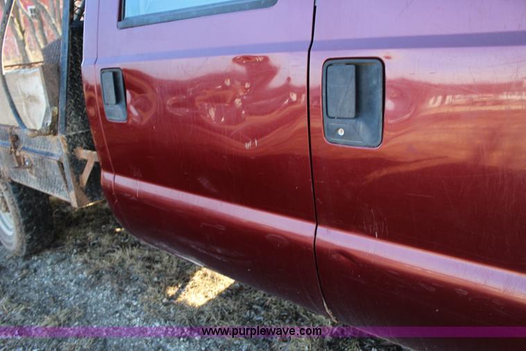 image for item L6552 2000 Ford F350 Super Duty XLT Crew Cab flatbed pickup truck