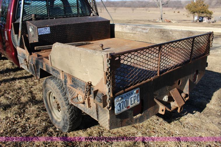 image for item L6552 2000 Ford F350 Super Duty XLT Crew Cab flatbed pickup truck