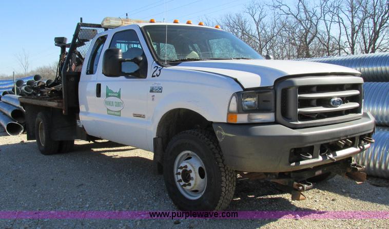 image for item AW9782 2004 Ford F350 Super Duty SuperCab flatbed pickup truck